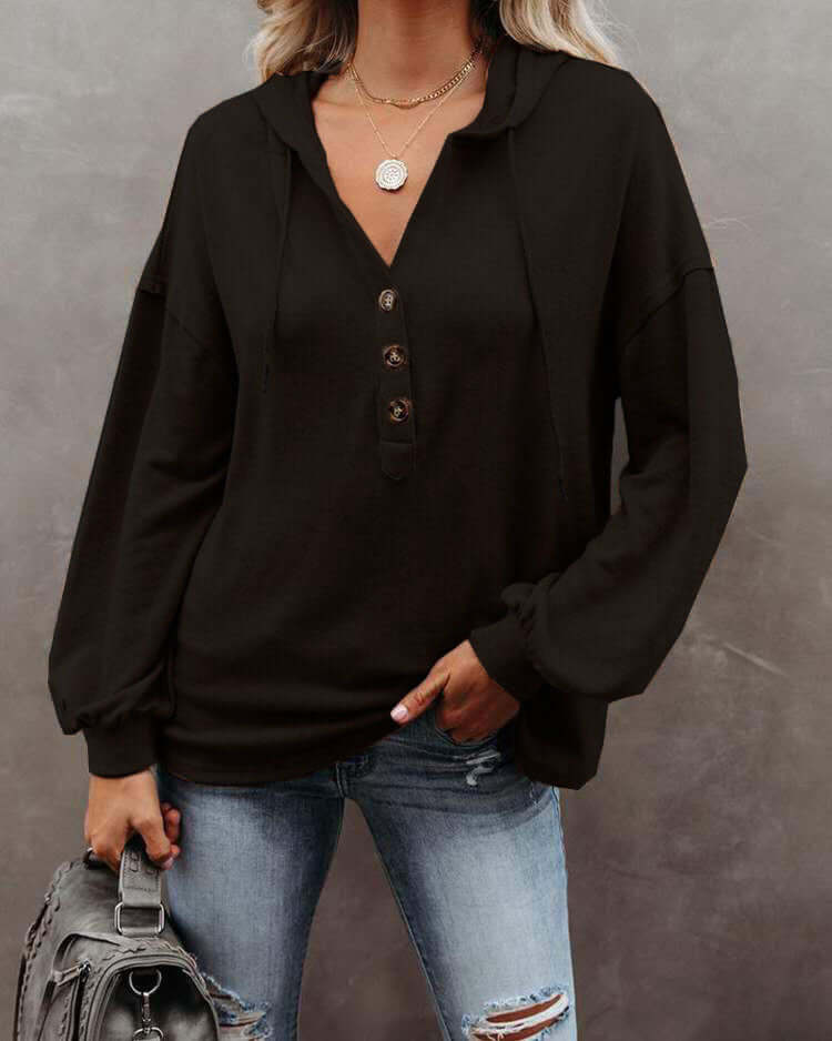 Autumn and Winter Solid Color Loose Hooded Woman in black, featuring long sleeves and a casual look.