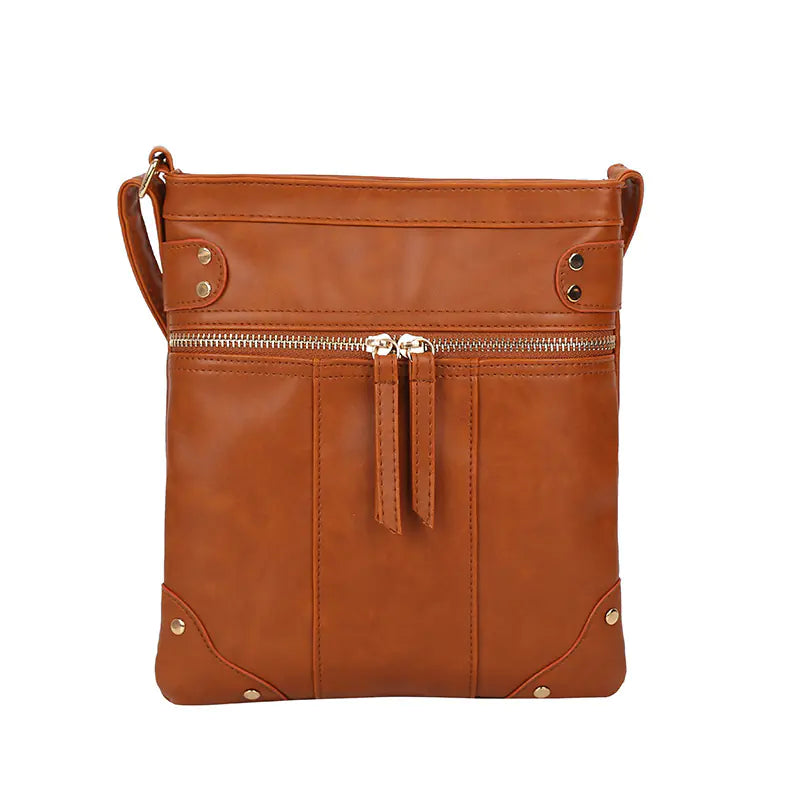 Vintage studded shoulder bag, chic zipper crossbody bag in brown PU fabric, perfect for modern moms on the go.