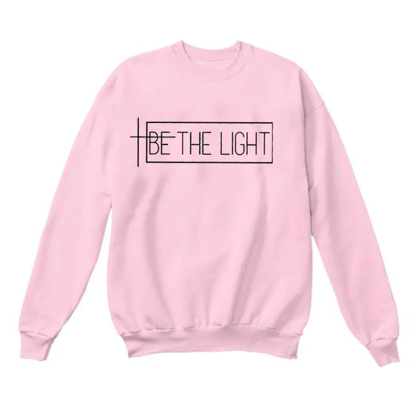 BE THE LIGHT pink streetwear sweatshirt with unique lettering design, perfect for style and comfort.
