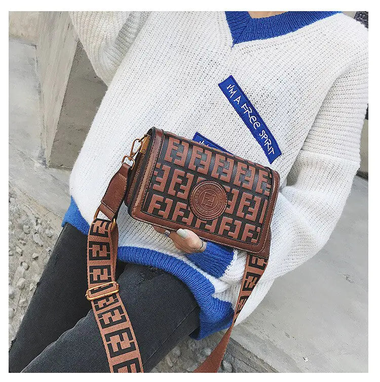 Vintage Shoulder Crossbody Bag in stylish brown design with logo, paired with cozy sweater for chic outfit.