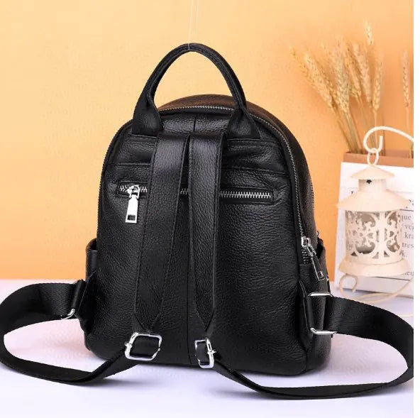 Stylish black leather backpack with adjustable straps, perfect for college style and daily use.