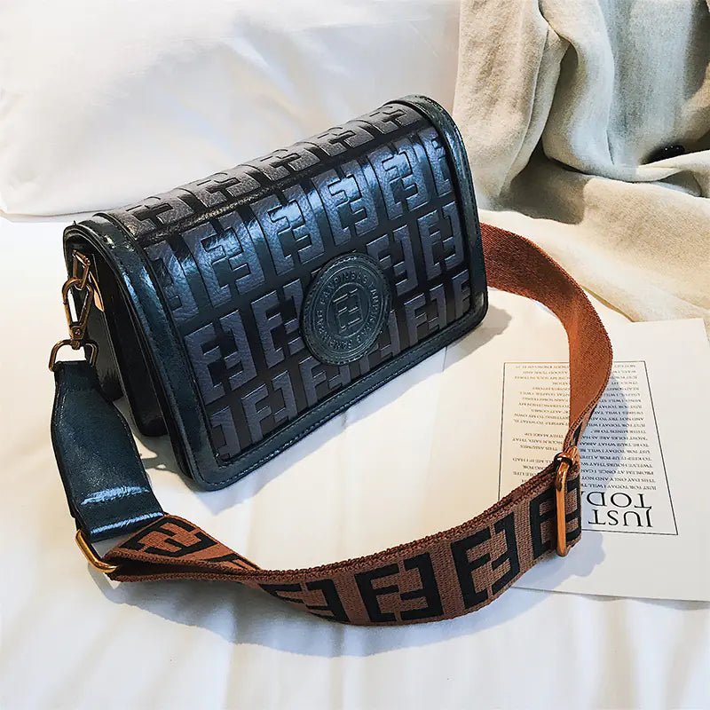 Vintage shoulder crossbody bag with stylish PU material, featuring a magnetic buckle and elegant design.