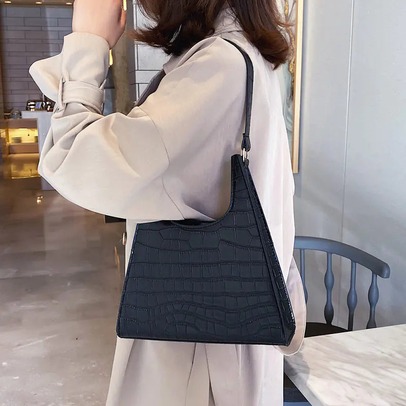 Stylish vintage women's handbag with crocodile texture, perfect for elevating any outfit.