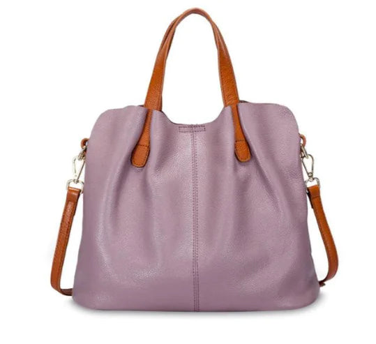Genuine leather women's tote bag in lavender with brown handles, perfect for stylish functionality.
