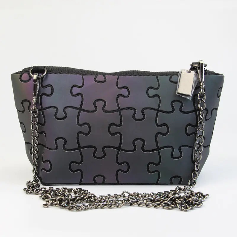 Trendy TPU gradient color laser shoulder bag with puzzle pattern and chain strap.