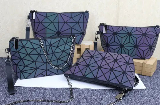 Trendy TPU gradient color laser shoulder bags in multiple designs, showcasing geometric patterns and stylish chain details.