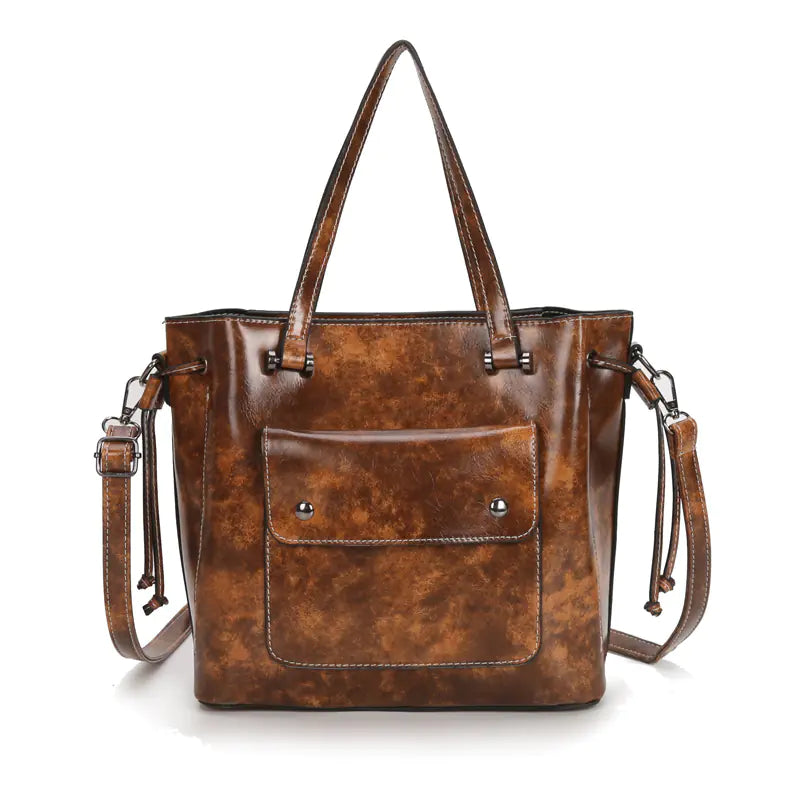 Fashion women's shoulder tote bag crafted from genuine leather, featuring a chic design and durable two-layer cowhide.