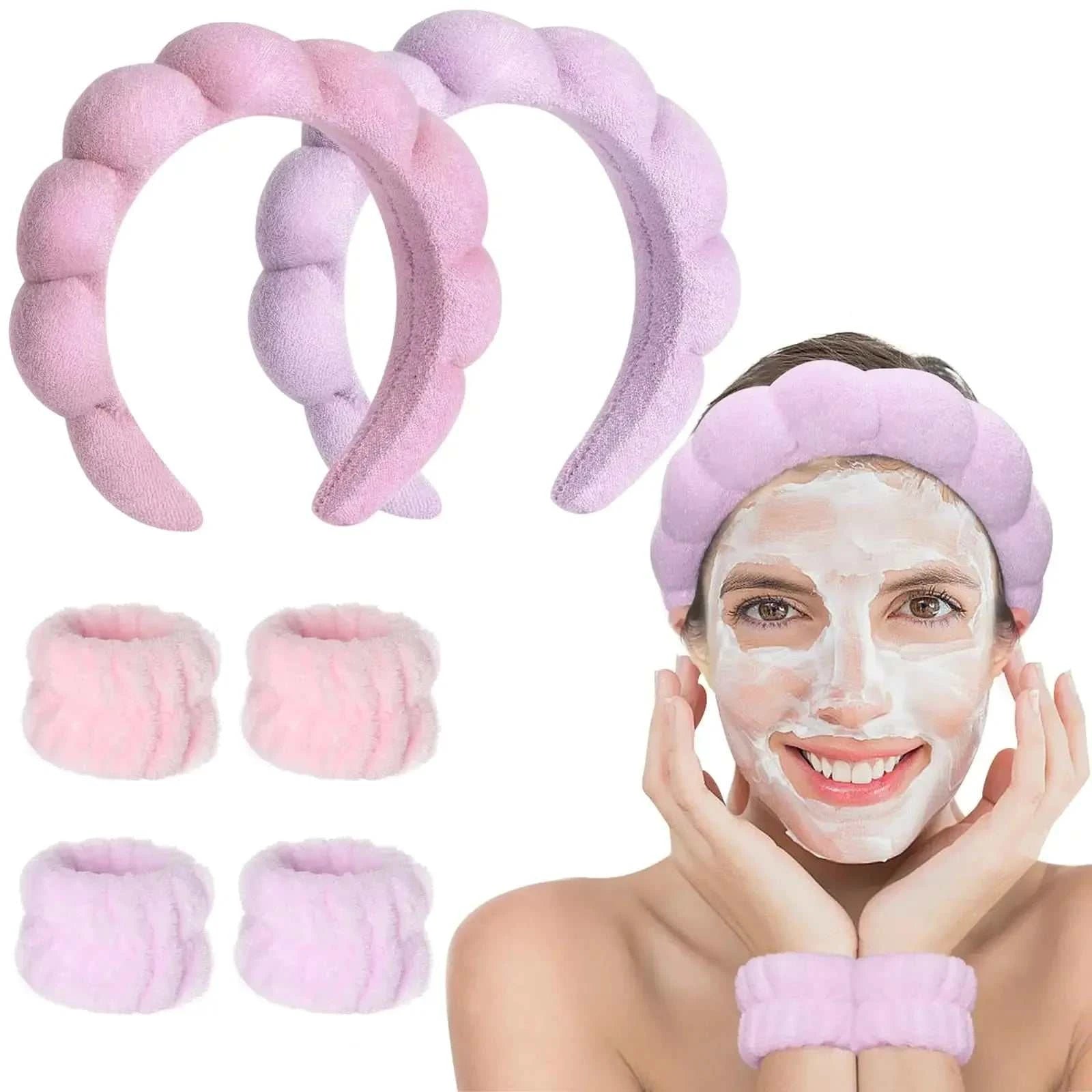 Pink and purple spa headband set for women's skincare, including a makeup headband, wristbands, and terry cloth bubble mask.