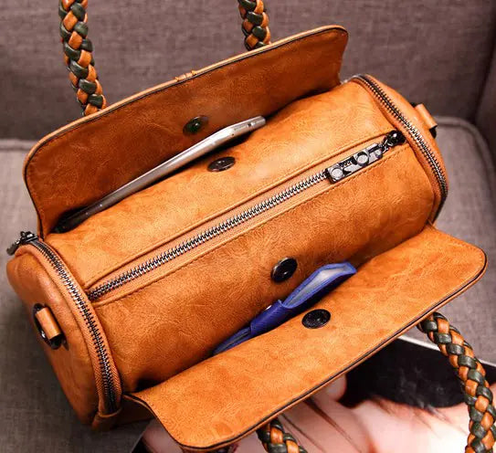 Interior view of a brown retro Boston bag showing compartments and storage features for convenience.
