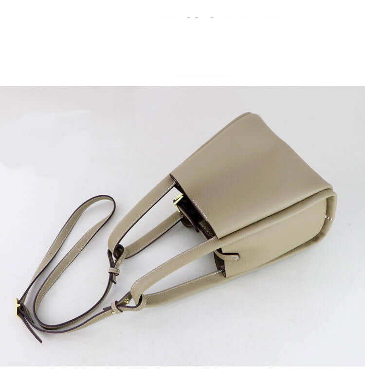 Make Your Own Leather Bags Hand Sewing Handmade Leather Goods in beige color with a stylish design and adjustable straps.