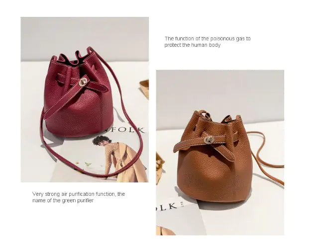 Two stylish bucket bags in burgundy and brown with unique closures showcased on a table.