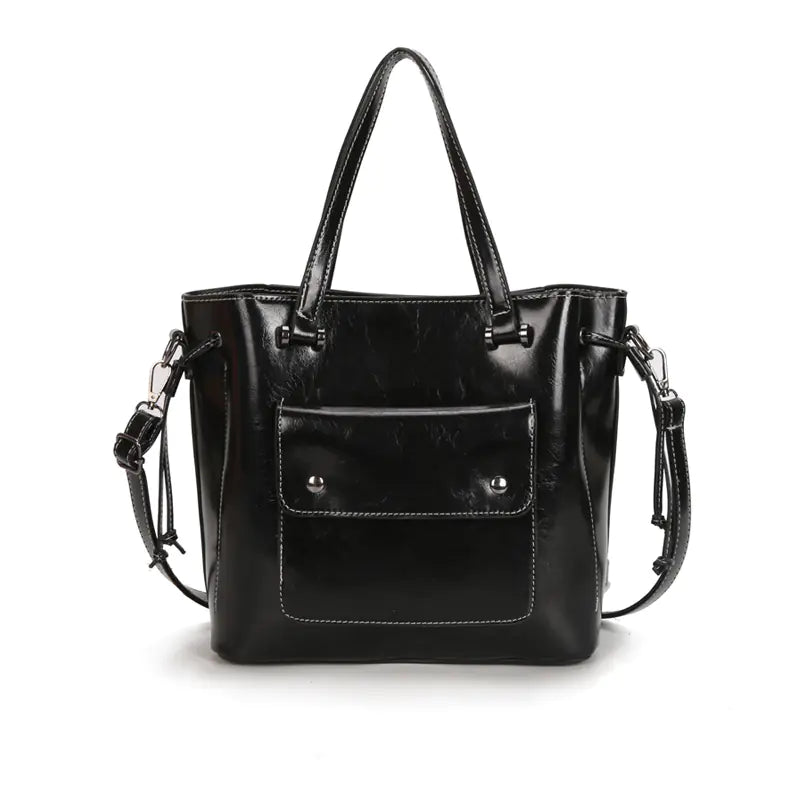 Elegant black leather shoulder tote bag with stylish design and detachable strap, perfect for modern women.