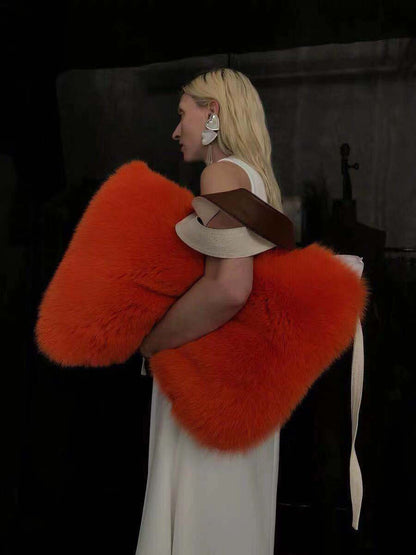 Woman in white dress holding a large orange plush bag showcasing Women's Bags, Handbags, Women's Shoulder Bags, Fur Bags, Plush Bags.