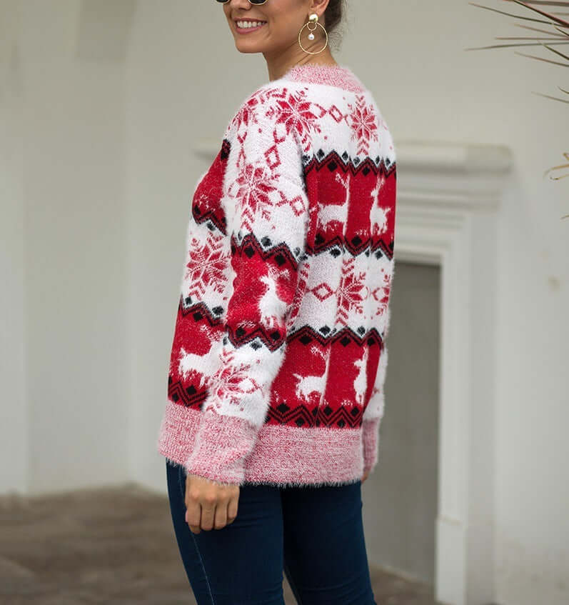 Snowflake deer pullover woman in red and white design worn by a woman, showcasing a cozy winter style.