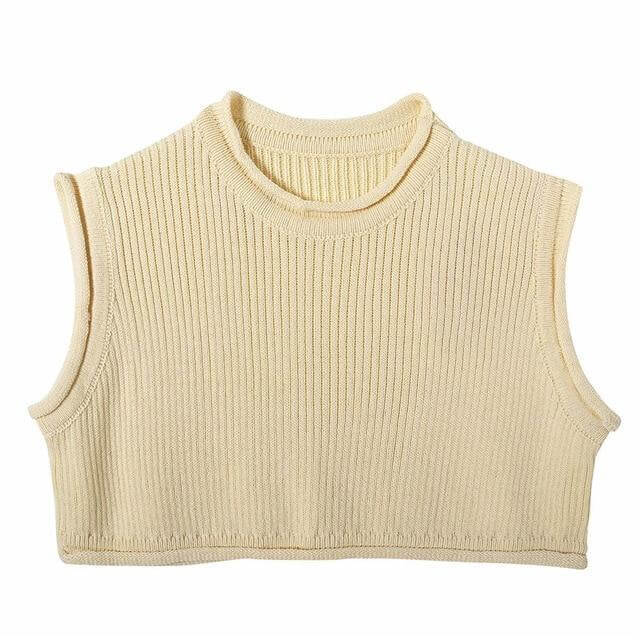 Knitwear top vest woman in light beige color, featuring a ribbed texture and sleeveless design.