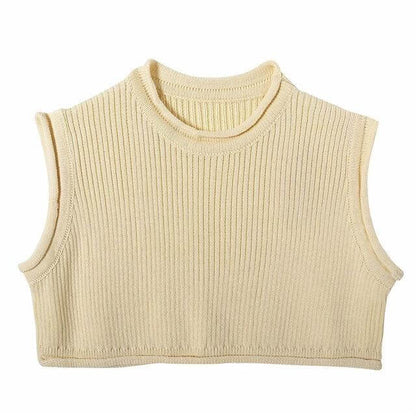 Knitwear top vest woman in light beige color, featuring a ribbed texture and sleeveless design.