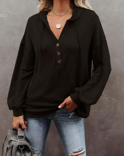 Autumn and Winter Solid Color Loose Hooded Woman in black, featuring long sleeves and a casual look.