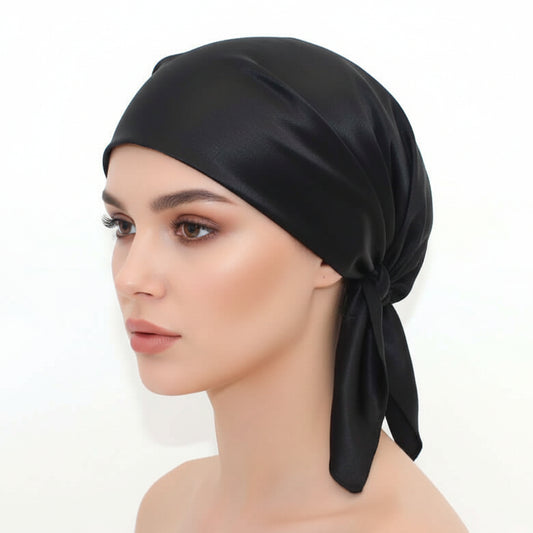 Hat confinement cap sleep cap pregnant woman cap in black silk on mannequin's head side view.