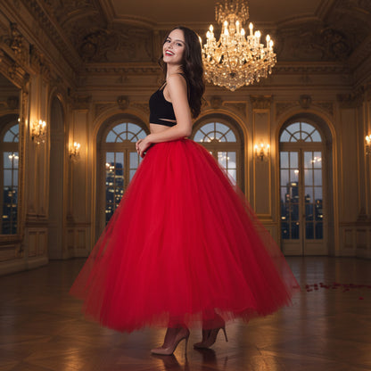 Elegant pregnant woman dress featuring a flowing red tulle skirt and stylish black top.