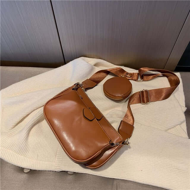 Hand Bag set Black College Luxury Bags For Women, featuring a brown small bag and round pouch on a cozy sweater.