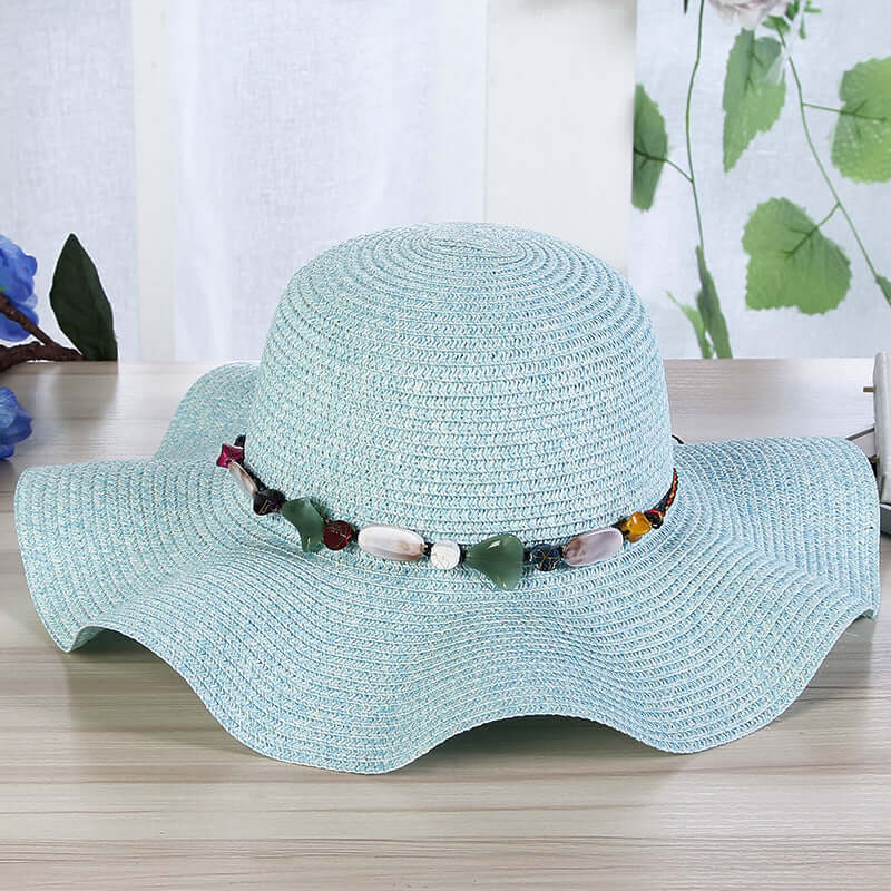 Hand-Woven Read Strange Stone Decorative Straw Hat Woman with a stylish flat eaves and dome top.