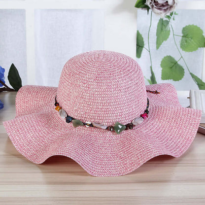 Hand-Woven Read Strange Stone Decorative Straw Hat Woman with pink color and decorative beaded band.