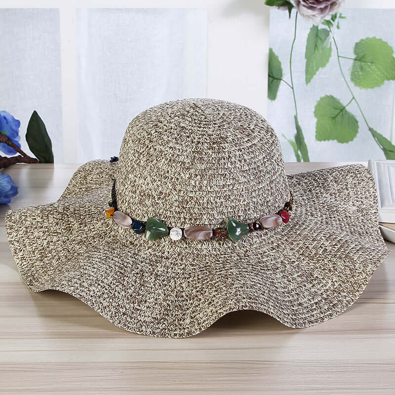 Hand-Woven Read Strange Stone Decorative Straw Hat Woman with a flat eaves and bead accents.