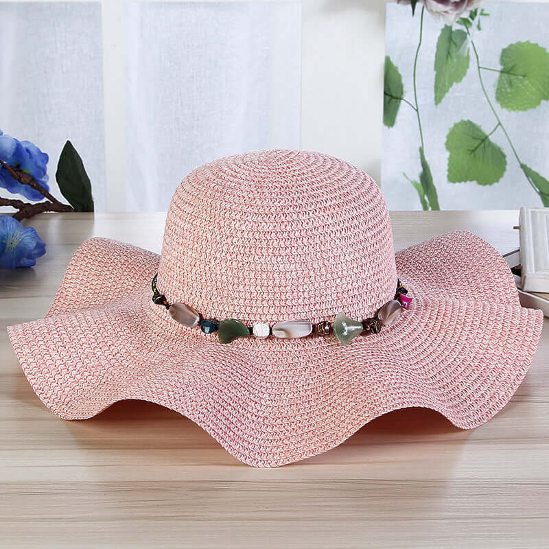 Hand-Woven Read Strange Stone Decorative Straw Hat Woman with decorative beads on a flat brim