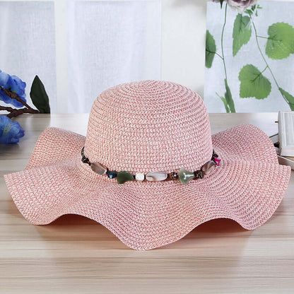 Hand-Woven Read Strange Stone Decorative Straw Hat Woman with decorative beads on a flat brim
