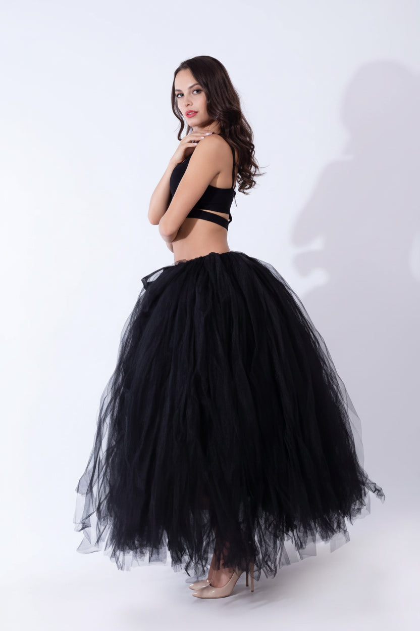 Pregnant woman dress showcasing a stylish black tulle skirt with an elegant design.