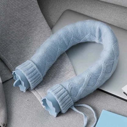 U-Shape Hot Water Bag Silicone Bottle Neck Hand Warmer Heater with Knitted Cover Water Storage Bags Keep Warm on a gray surface.