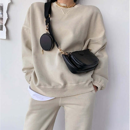 Hand Bag set Black College Luxury Bags For Women worn with casual outfit, featuring small black bag and round bag detail.