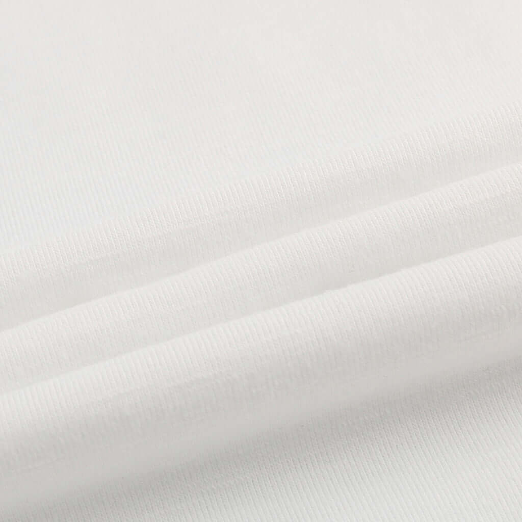 Close-up of soft, white fabric for Evil Woman print T-shirt, showcasing the quality and texture.