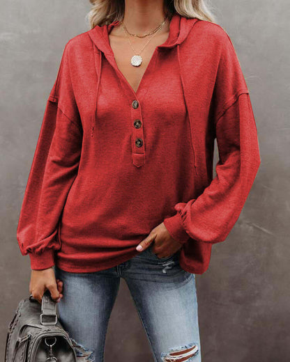 Autumn and Winter Solid Color Loose Hooded Woman in red with buttons and long sleeves, perfect for casual wear.