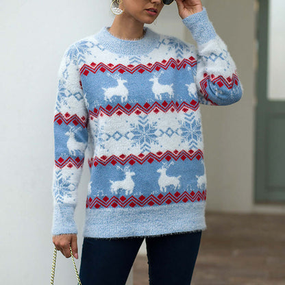 Snowflake deer pullover woman in blue featuring white deer and snowflake patterns, perfect for a casual winter look.