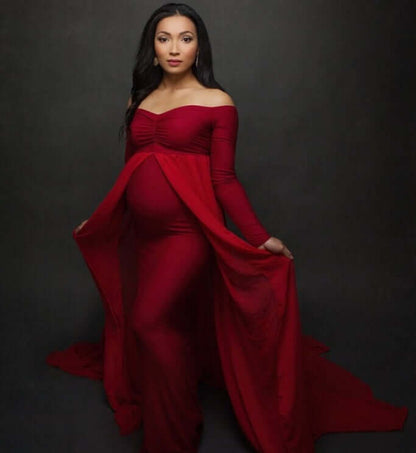 Pregnant woman cloak dress in elegant red chiffon, showcasing long sleeves and flowing design.
