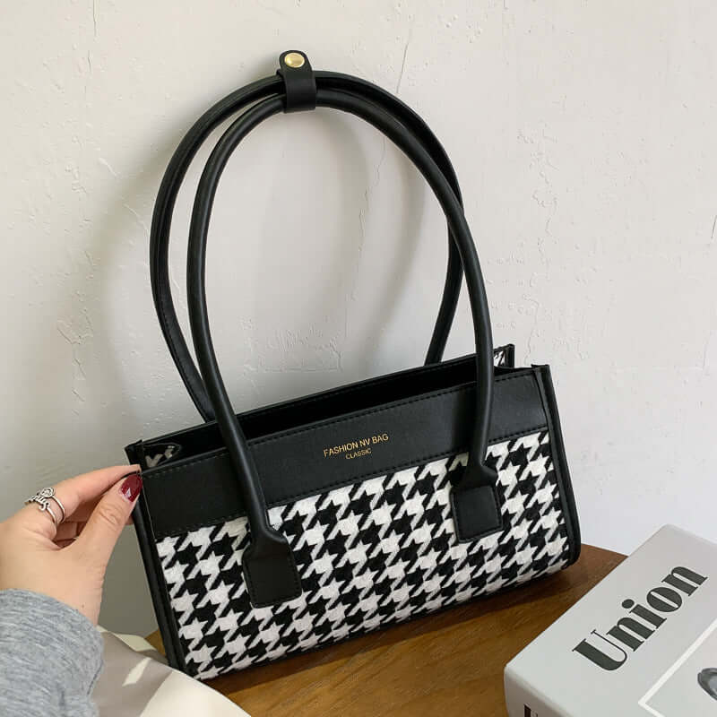New Tide Autumn Winter Fashion Versatile Plaid Hand Carry Bags displayed with trendy design and stylish black and white fabric.