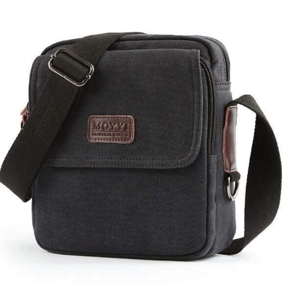 Shoulder Bags in black canvas with adjustable strap and front flap, ideal for daily use.