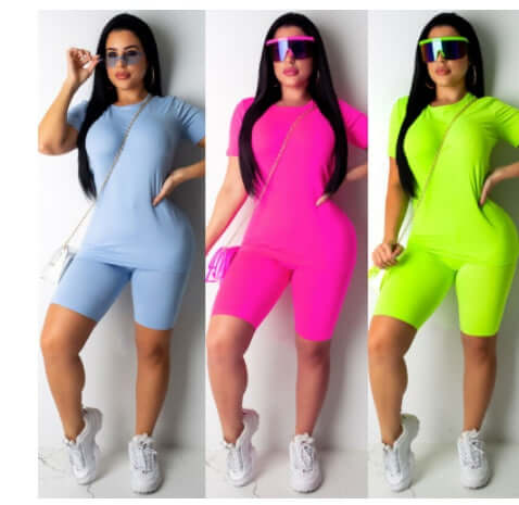 Casual woman solid color sportswear displayed in blue, pink, and green color options.