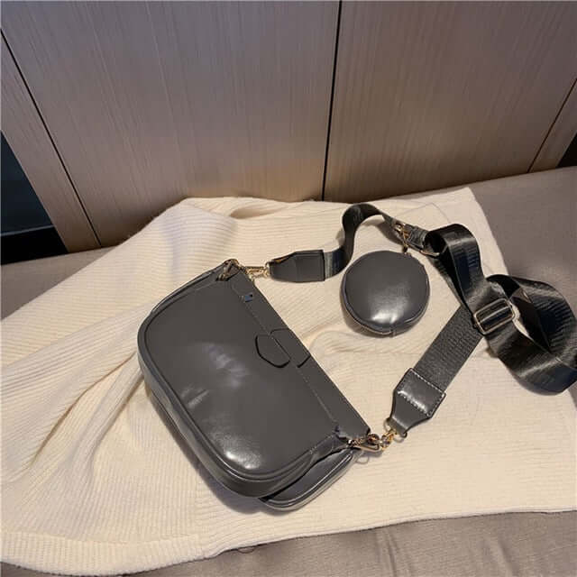Hand Bag set Black College Luxury Bags For Women on a cozy blanket, showcasing a sleek black bag.