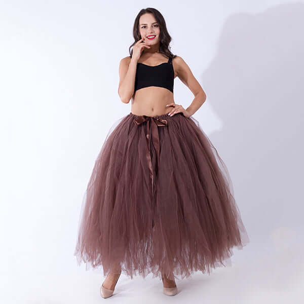 Pregnant woman dress featuring a chic brown tulle skirt and stylish crop top for expectant mothers.