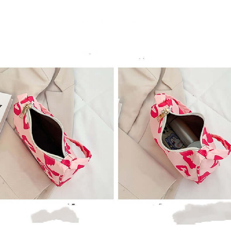 Korean Street Trend Hand-carried Women's Bags in pink with pattern, showing zipper closure and interior details.