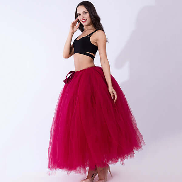 Pregnant woman dress with a stylish pink tulle skirt, showcasing comfort and elegance for expecting mothers.