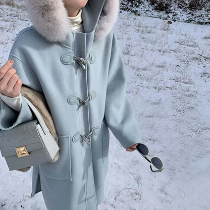 Crocodile-Pattern Leather Handbag – Versatile Carry with blue coat and fur collar in snowy landscape.
