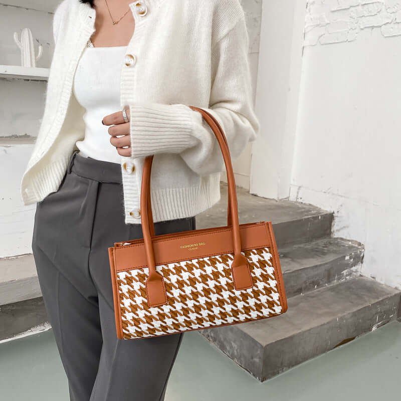 New Tide Autumn Winter Fashion Versatile Plaid Hand Carry Bags in stylish setting with model holding bag.