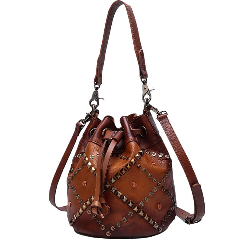 Cowhide Bucket Shoulder Bag With Rivet Detail - Stylish vintage leather bag with rivet accents and adjustable strap.