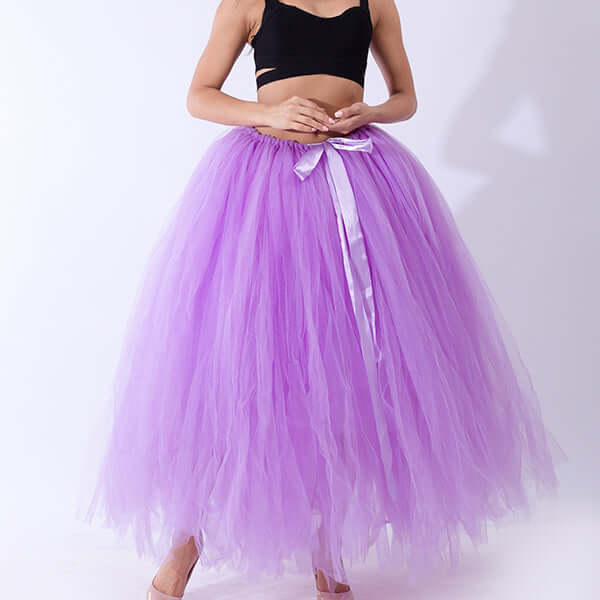 Pregnant woman dress in purple tulle skirt, perfect for stylish maternity wear, featuring a satin ribbon tie.