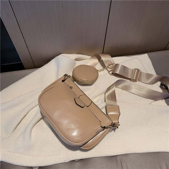 Hand Bag set Black College Luxury Bags For Women in beige with round pouch on a light blanket.