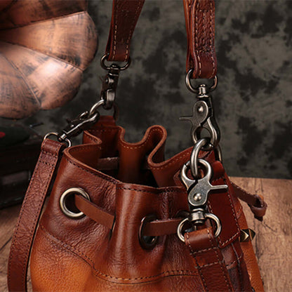 Cowhide Bucket Shoulder Bag With Rivet Detail showing leather texture and strap details.