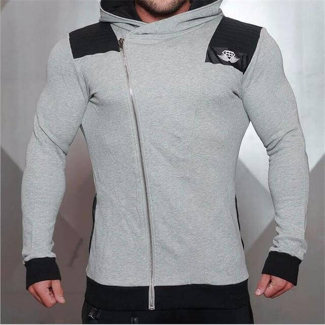 New Gyms Slim Fit Hoodies modeled by a man in a stylish gray zip-up hoodie with black accents.